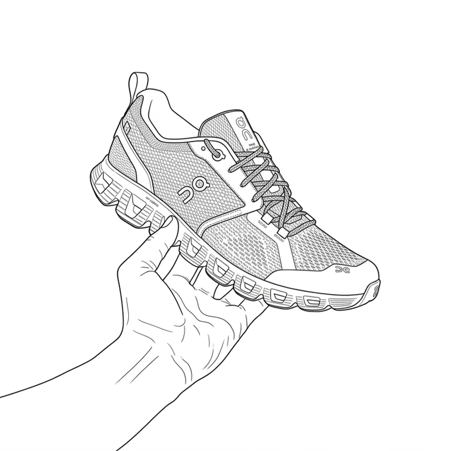 スニーカーを手で持っている